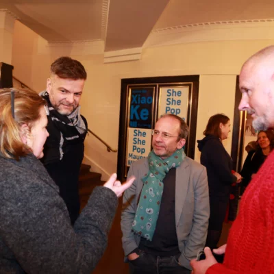 Reception after the film premiere: guests in relaxed atmosphere in conversation