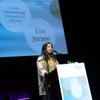 Choreographer Eisa Jocson during her acceptance speech at the lectern.