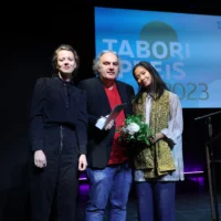 Portrait of Eisa Jocson together with the jurors of the Tabori Award International on stage at HAU 1.